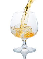 A glass of brandy on a white background.