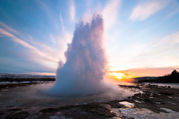 Fototapeta premium The Strokkur Geyser erupting at the Haukadalur geothermal area, part of the golden circle route, in Iceland