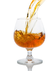 a glass of brandy on a white background.