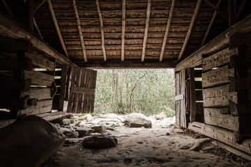 Fototapeta na wymiar The Simple Life. Interior of pioneer barn on the Roaring Fork Motor Nature Trail in Great Smoky Mountains. This is a historical building in a national park. It is not a privately owned property.