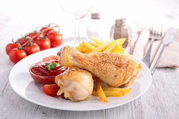 grilled chicken leg and french fries