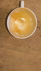 Empty coffee cup on wood table at coffee shop