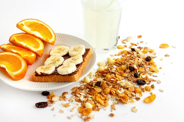 delicious juicy oranges and banana on bread with chocolate and f