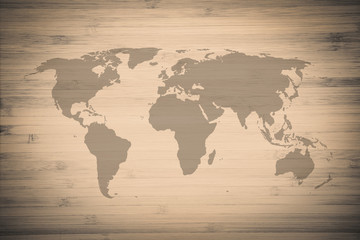 Fototapeta na wymiar World map on wood texture background