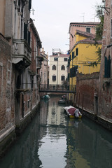 Fototapeta na wymiar Rainy day. Narrow canal in Venice. Venice. Italy