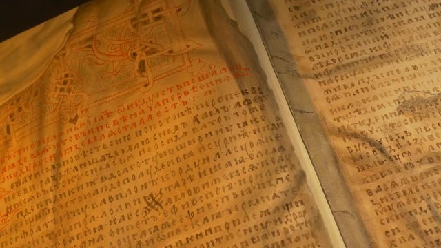 Ancient Book is Opening Picture Obsolete Lettes Tale of Bygone Years Primary Chronicle Eastern Slavs' History Nestor's Chronicle Light of Candle