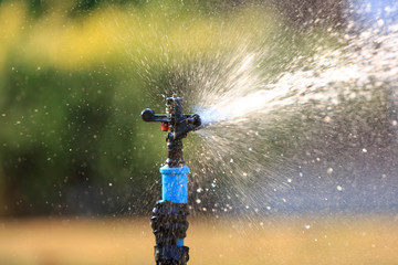 Fototapeta na wymiar Sprinkler system for water splash