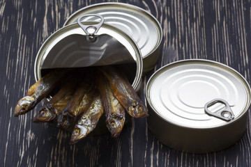 Close-up of Tinned capelin fish on wooden background