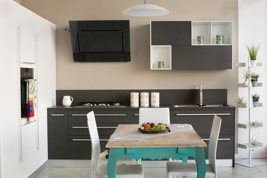 Modern kitchen with an old style table