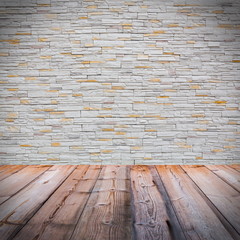 White brick wall with wooden floor