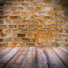 Red brick wall  with wooden floor