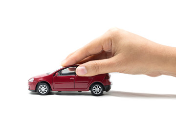 Hand with red car on a white background