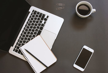 Creative flat lay design of workspace desk with laptop, notebook