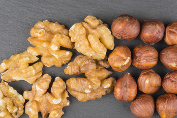 Walnuts and Forest nuts on black background