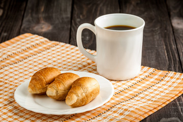 small croissants and cup of coffee