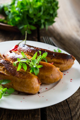Grilled sausages with spices and herbs