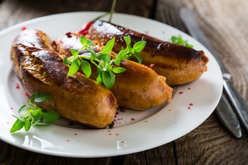 Grilled sausages with spices and herbs