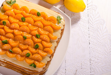 citrus cake, decorated with mandarin and mint