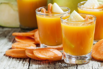 Freshly squeezed juice of carrots and green apples, selective fo