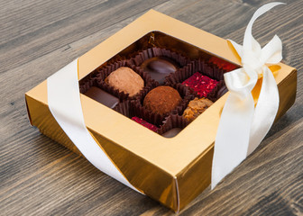  natural chocolate with cacao on wooden background