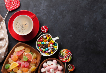 Obraz na płótnie Canvas Coffee, colorful candies, jelly and marmalade