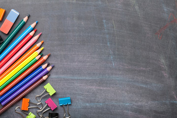 School supplies on blackboard background