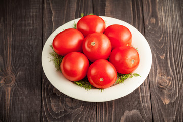 plum tomatoes on wooden rustic background