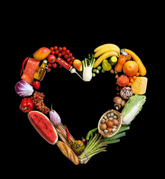 Deluxe Heart symbol. Studio photography of heart made from different fruits and vegetables on black background. High resolution product.