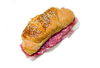 Cornetto savory filling with sausage on a white background seen from above