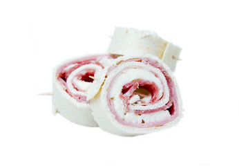 Rolls of flat bread with salami on white background