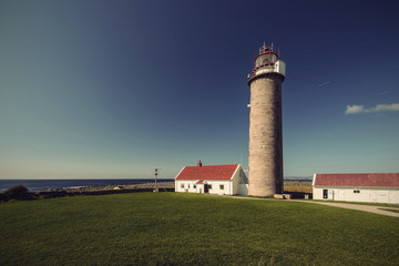 Fototapeta na wymiar Lighthouse Lista Fyr on peninsula Lista in southern Norway, Europe, vintage filtered style 