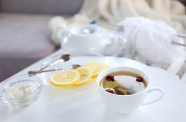 Tea set on a white wooden tray