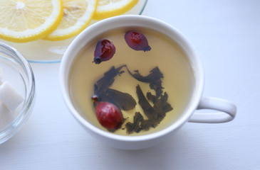 Tea set on a white wooden tray, closeup