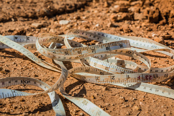 Measuring tape placed on the ground at a construction site