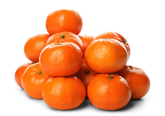A pile of fresh tangerines isolated on white background, close up