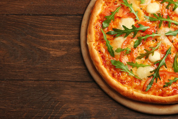 Margherita pizza with arugula on  background