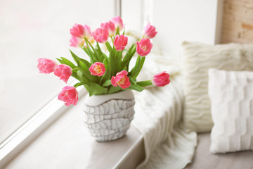 Fresh bouquet of tulips on a windowsill