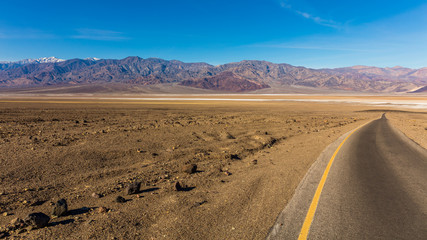 Road through canyons with lots of different topography. The road offers majestic views. It contains colorful rock formation. BADWATER RD, Death Valley National Park