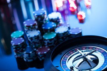 Fototapeta premium casino theme, high contrast image of casino roulette, playing chips and dice