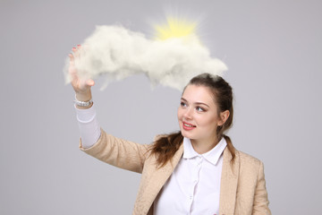 Young woman and sun shining out from behind the clouds, cloud computing  or weather concept