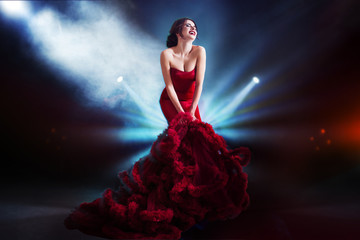 Beauty Brunette model woman in  evening red dress. Beautiful fashion luxury makeup and hairstyle....
