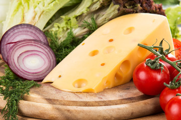 yellow cheese with fresh vegetables