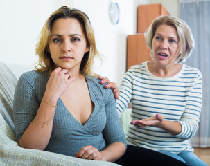 Senior mother screaming on adult daughter in domestic argument