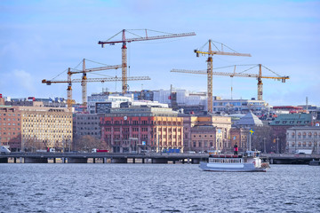 Fototapeta premium Stockholm, Sweden - March, 17, 2016: Panorama of Stockholm, Sweden with tower cranes