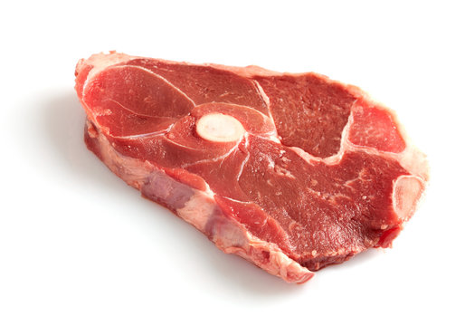 Raw steak isolated on white background