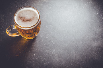 Beer glass on dark table. Close up