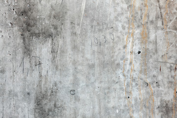 Texture concrete wall with streaks of rust and figures