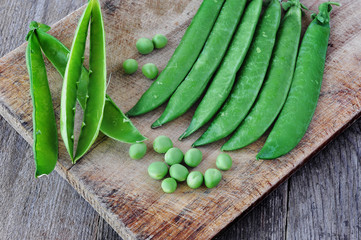 Green peas on the wood backgraund.