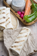 Fototapeta na wymiar burrito on parchment with vegetables