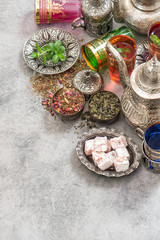 Obraz na płótnie Canvas Green tea with herbs spices. Oriental dishes decorations